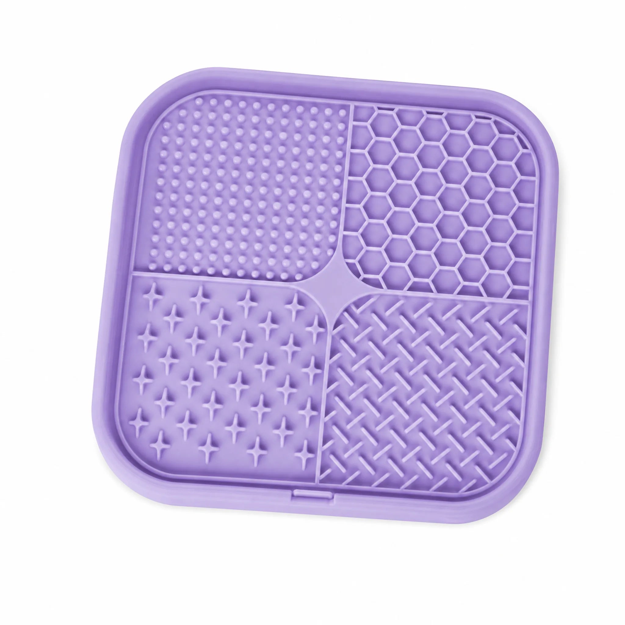 Tappetino leccalecca in silicone viola per cani con quattro texture diverse e bordo rialzato, sfondo bianco
